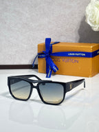 Louis Vuitton sunglasses with black frames and tan gradient lenses