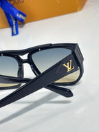 Louis Vuitton sunglasses temple close-up with LV logo on black frame