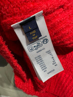 Red knit cardigan care label patch on inner seam