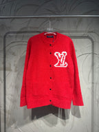 Red button-up cardigan with large white LV-style logo on the chest