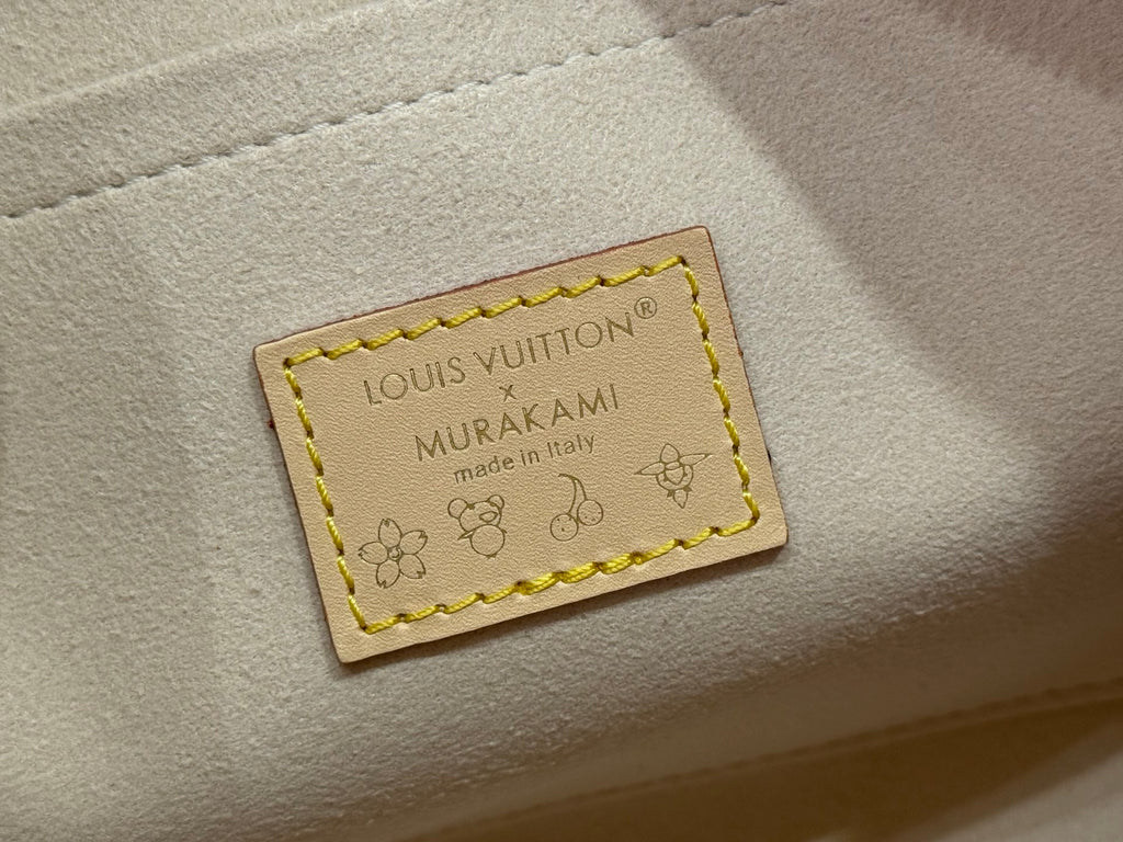 Leather brand label on the bag reading Louis Vuitton Murakami, made in Italy