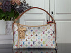 Designer tote bag with multicolor monogram pattern, leather trim, and top handles