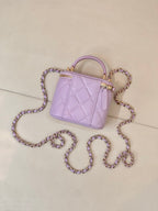 Chanel lavender quilted mini handbag with gold-tone hardware and chain strap close view
