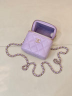 Chanel lavender quilted mini handbag with open zip top and gold-tone CC front