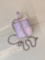 Lavender Chanel quilted bag with gold-tone zipper, top handle and chain strap
