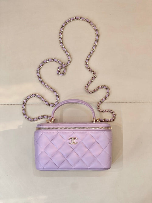 Lavender Chanel quilted mini bag with gold-tone CC clasp, top handle and chain strap