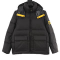 Black puffer jacket with hood, zip front, and yellow logo patches