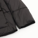 Black quilted puffer jacket sleeve and hem with folded cuff edge