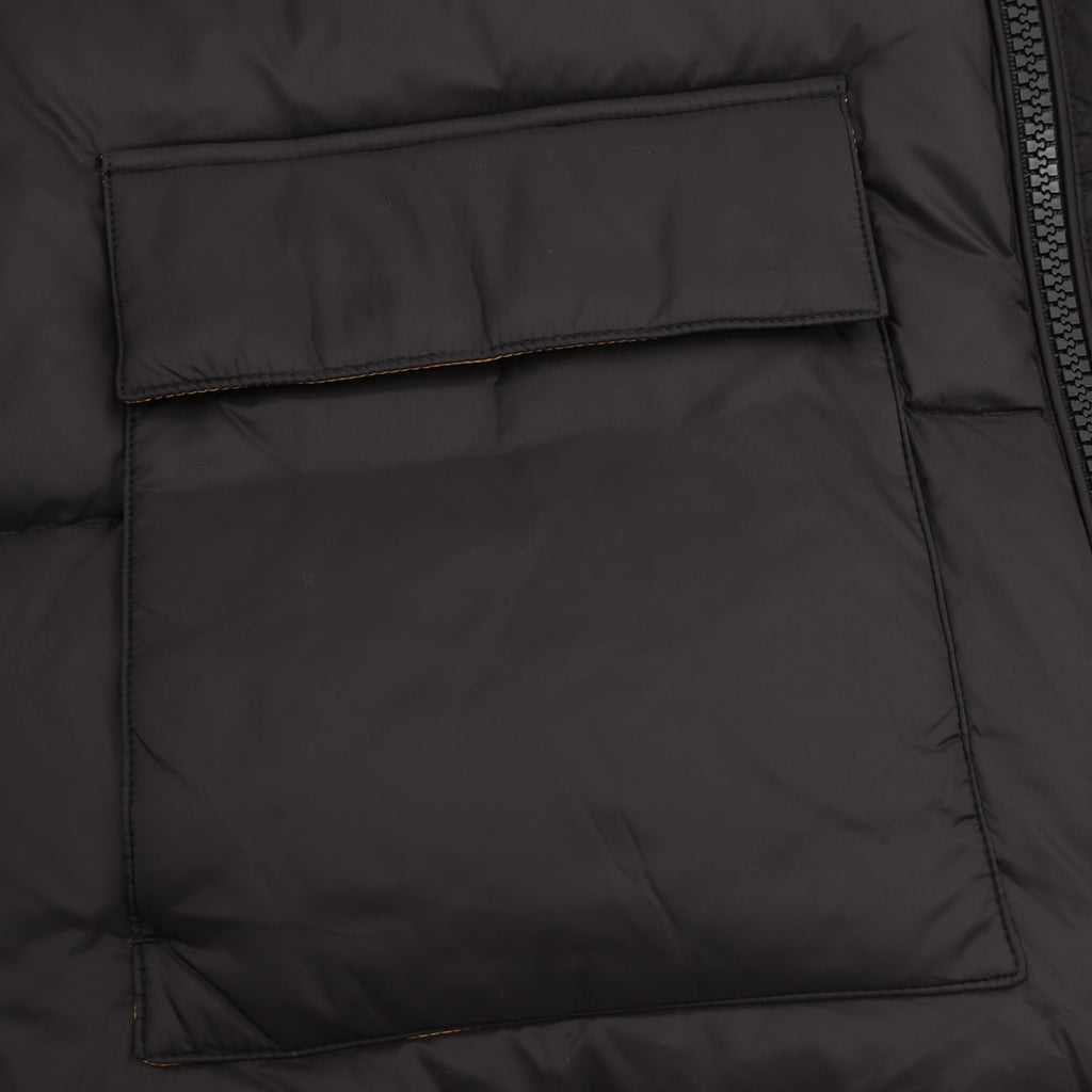 Black puffer jacket front pocket panel with stitched borders