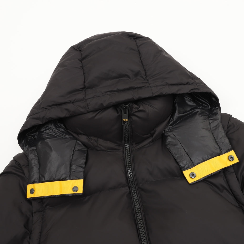 Black puffer jacket hood with zipper and yellow snap logo tabs