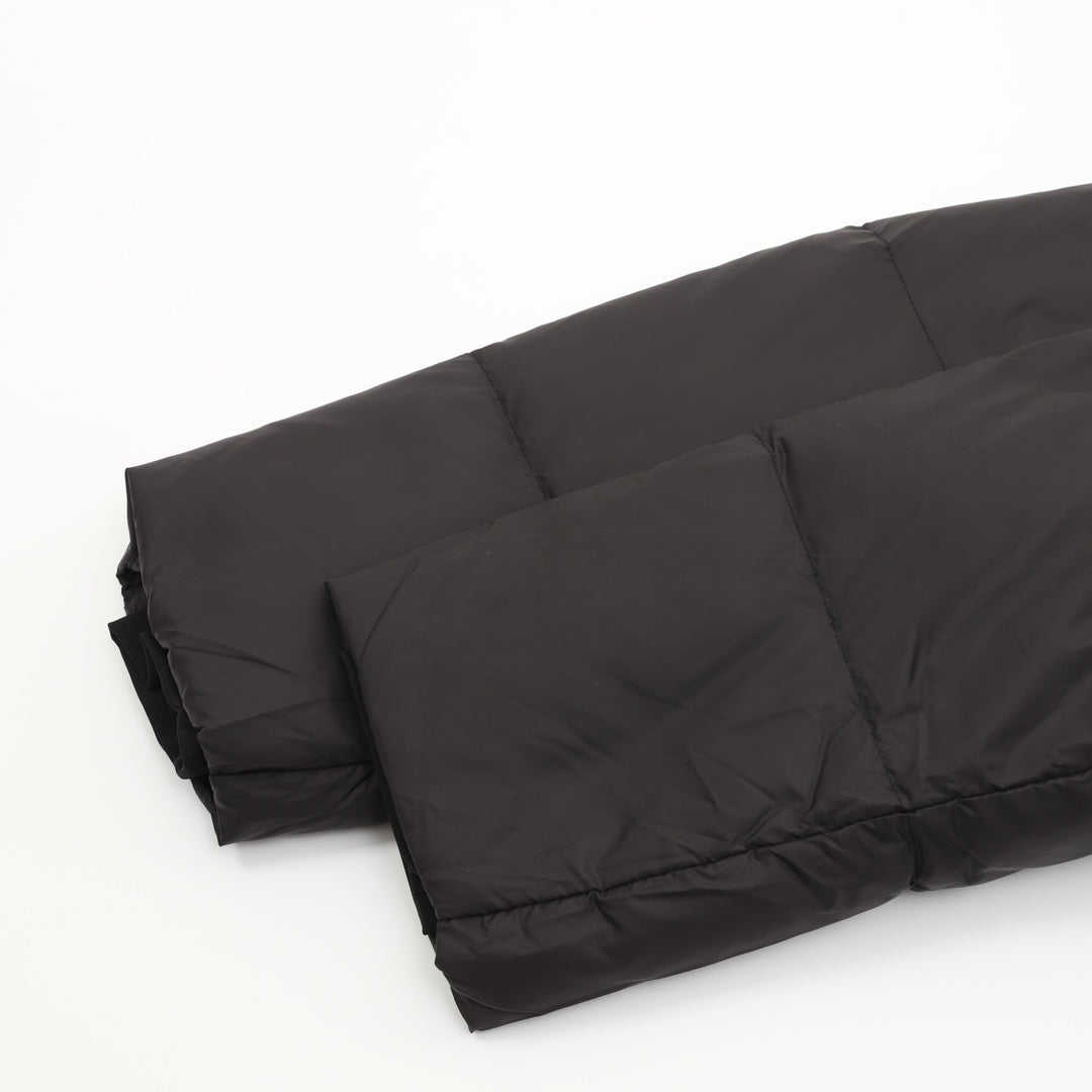 Black puffer jacket lower hem with quilted padding