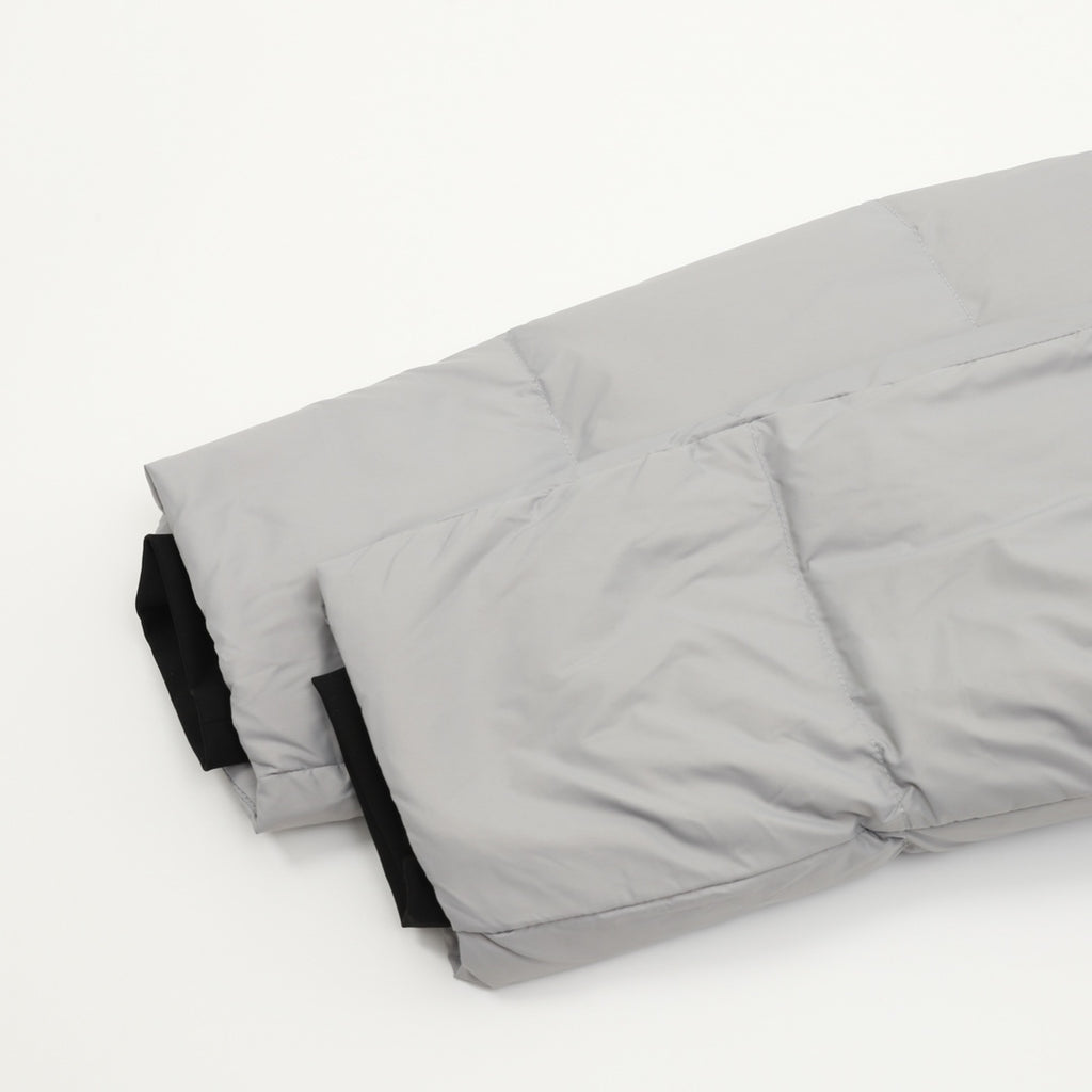 Puffer jacket hem and back panel, light gray quilted fabric with black lining