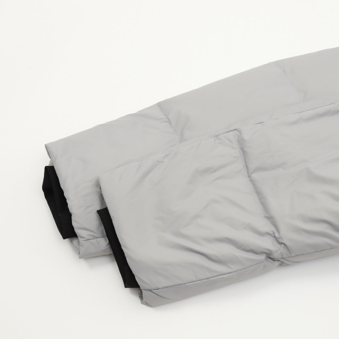 Puffer jacket hem and back panel, light gray quilted fabric with black lining