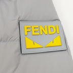 Puffer jacket patch with FENDI yellow emblem on light gray fabric