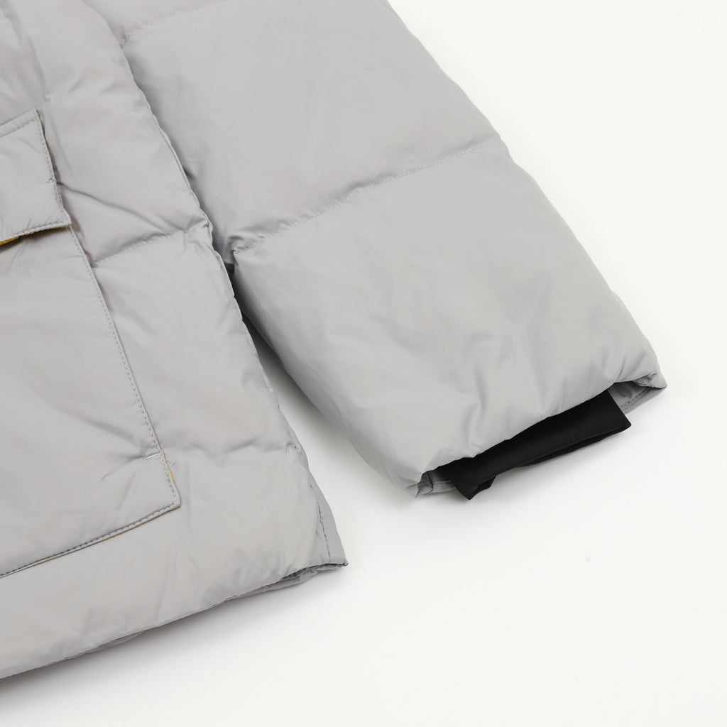 Puffer jacket sleeve and cuff with quilted seams, gray and black inner trim