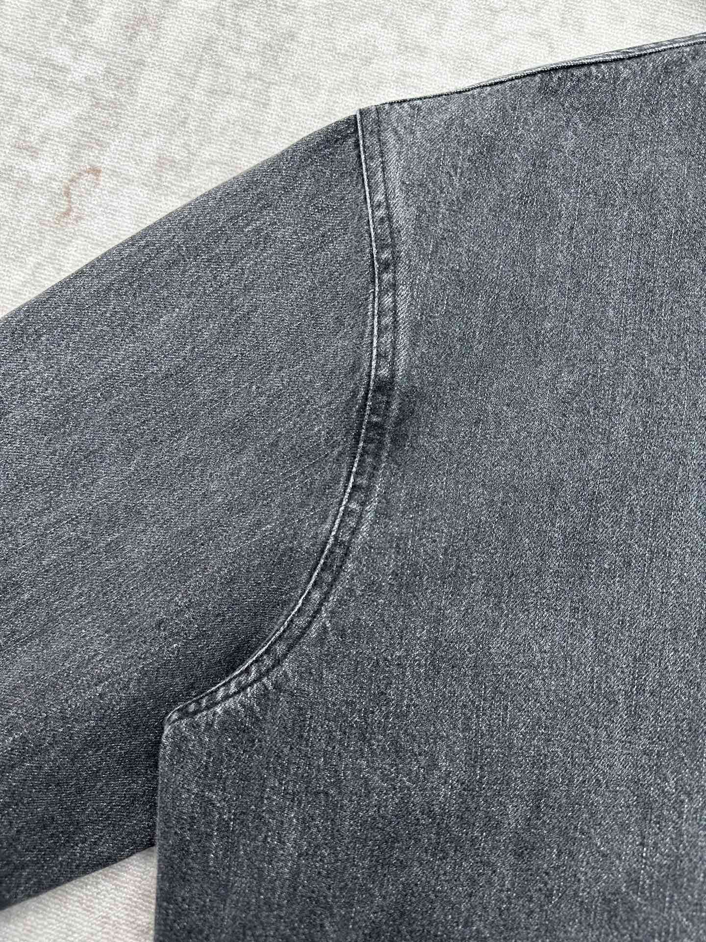 Dior denim jacket sleeve seam close-up