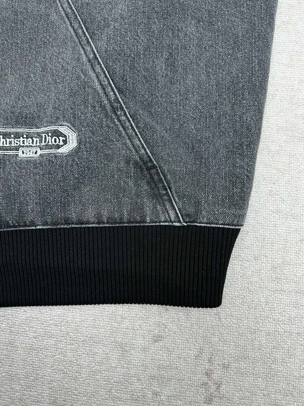 Dior denim jacket hem with ribbed cuff trim and side seam