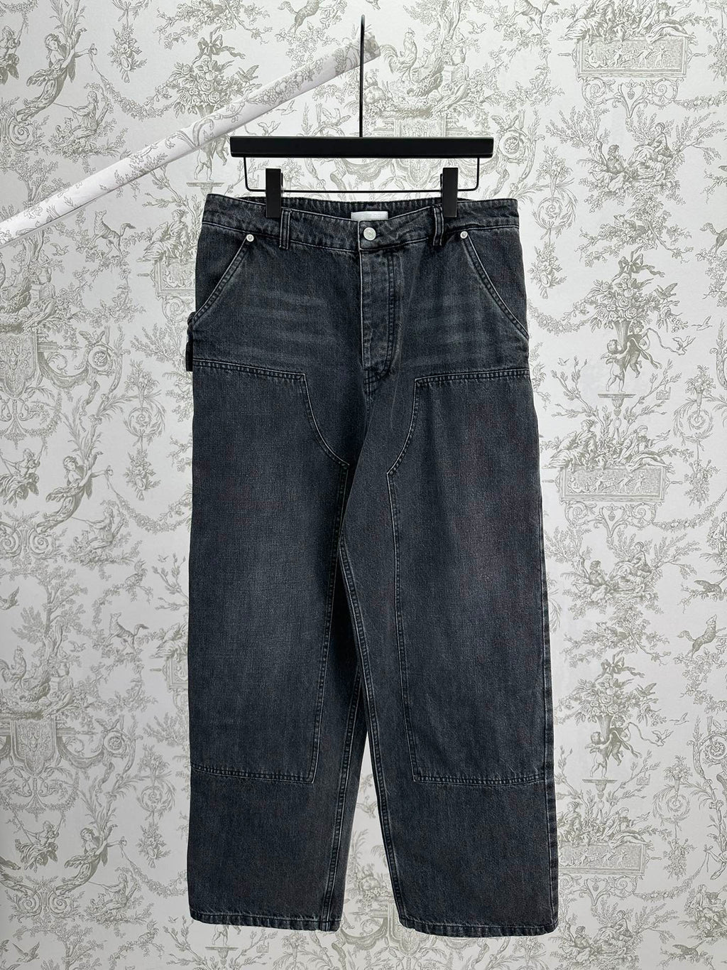 Dark blue denim pants with belt loops, front button, and straight-leg fit