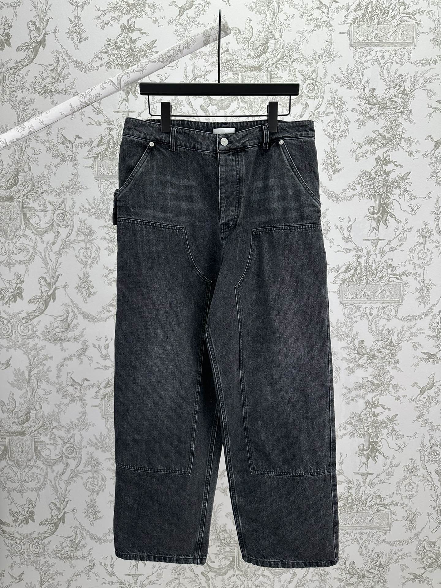 Dark blue denim pants with belt loops, front button, and straight-leg fit