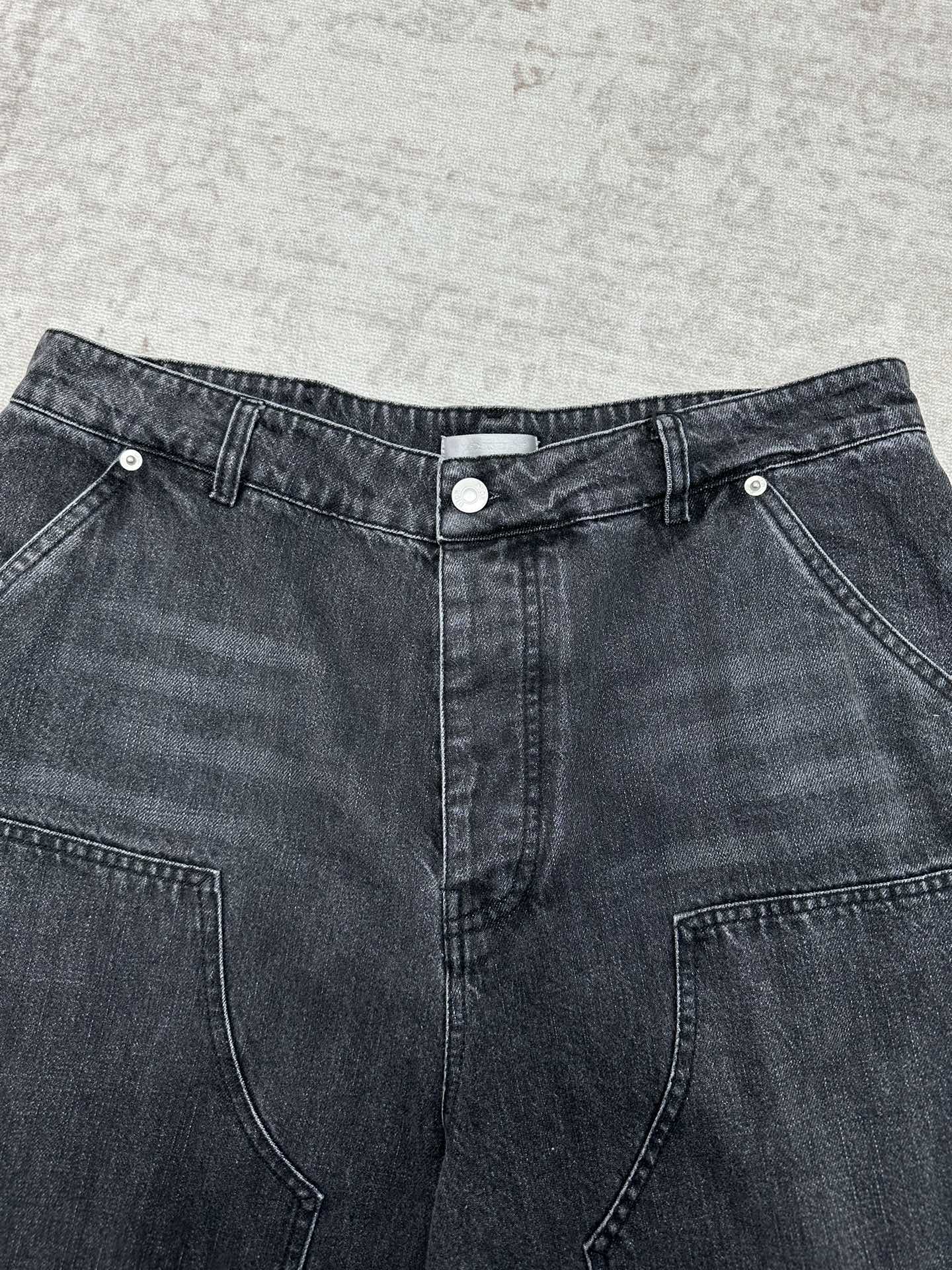 Denim pants waistband with button closure, belt loops, and front pockets