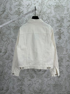 Long white jacket back view with buttoned hem and yoke seam