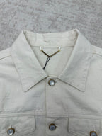 Long white jacket neckline with pointed collar, snap buttons, gold chain detail