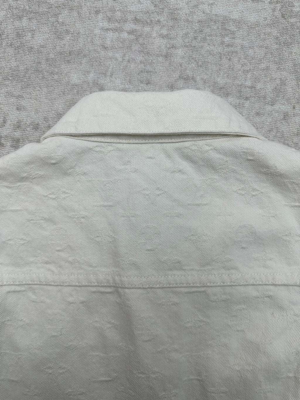 Long white jacket back with yoke seam and hidden button placket