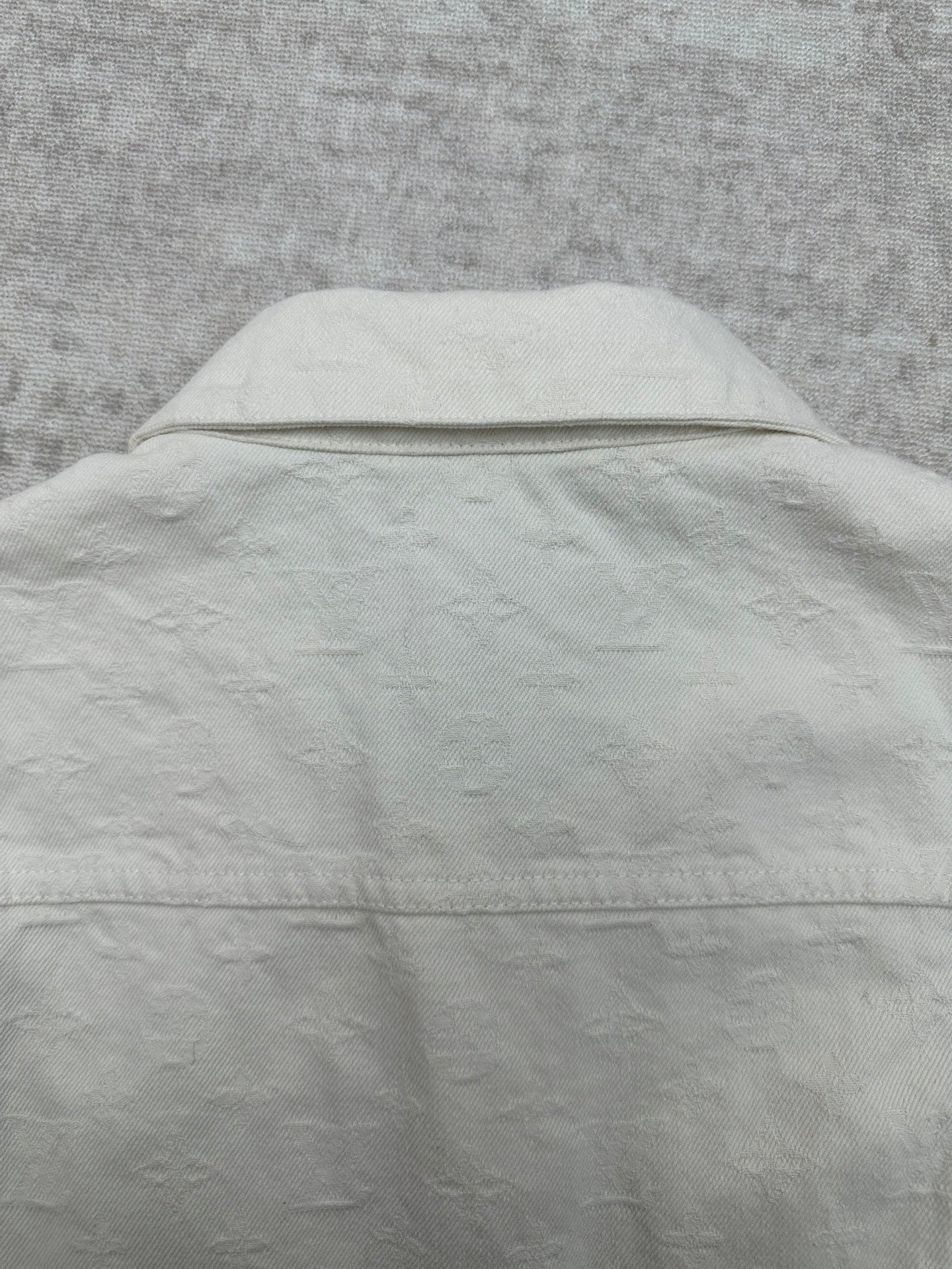 Long white jacket back with yoke seam and hidden button placket