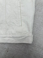Long white jacket lower back panel with vertical stitched seam