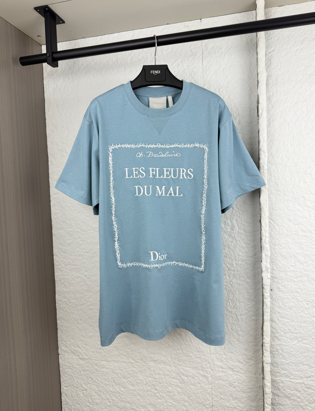 Light blue Dior short-sleeve T-shirt with “LES FLEURS DU MAI” front print