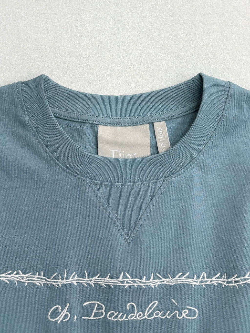 Light blue Dior T-shirt neckline with “LES FLEURS DU MAI” embroidery