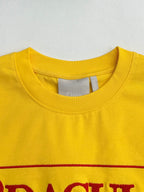 Yellow short-sleeve T-shirt neckline with interior brand tag