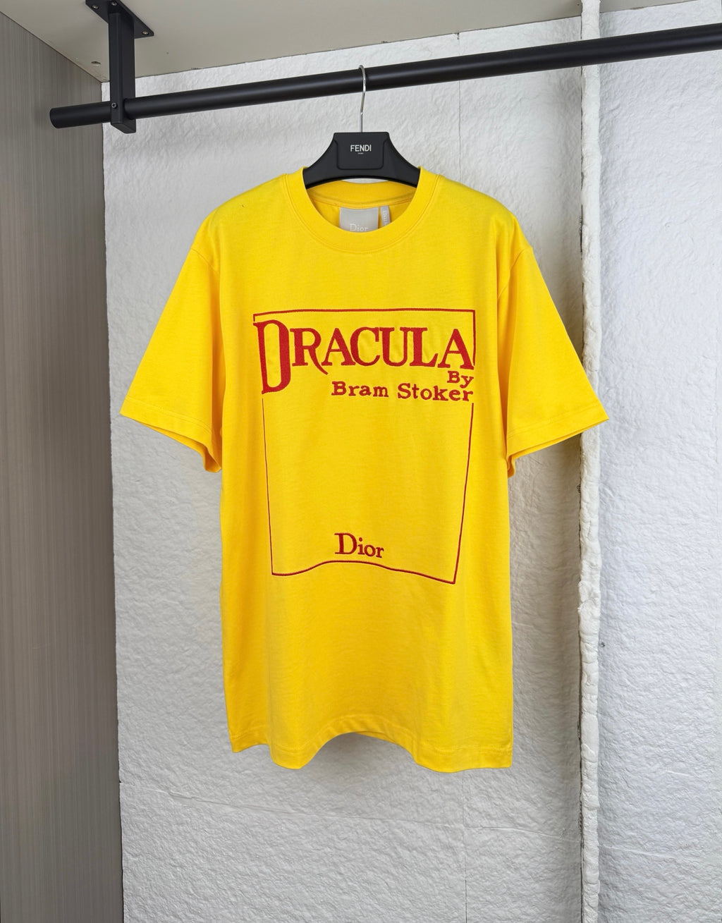 Yellow short-sleeve T-shirt with red graphic 'DRACULA' and 'Bram Stoker' and Dior