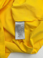 Yellow T-shirt interior with size and care label at center
