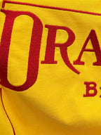 Yellow T-shirt front graphic with large red letters 'DRACULA'