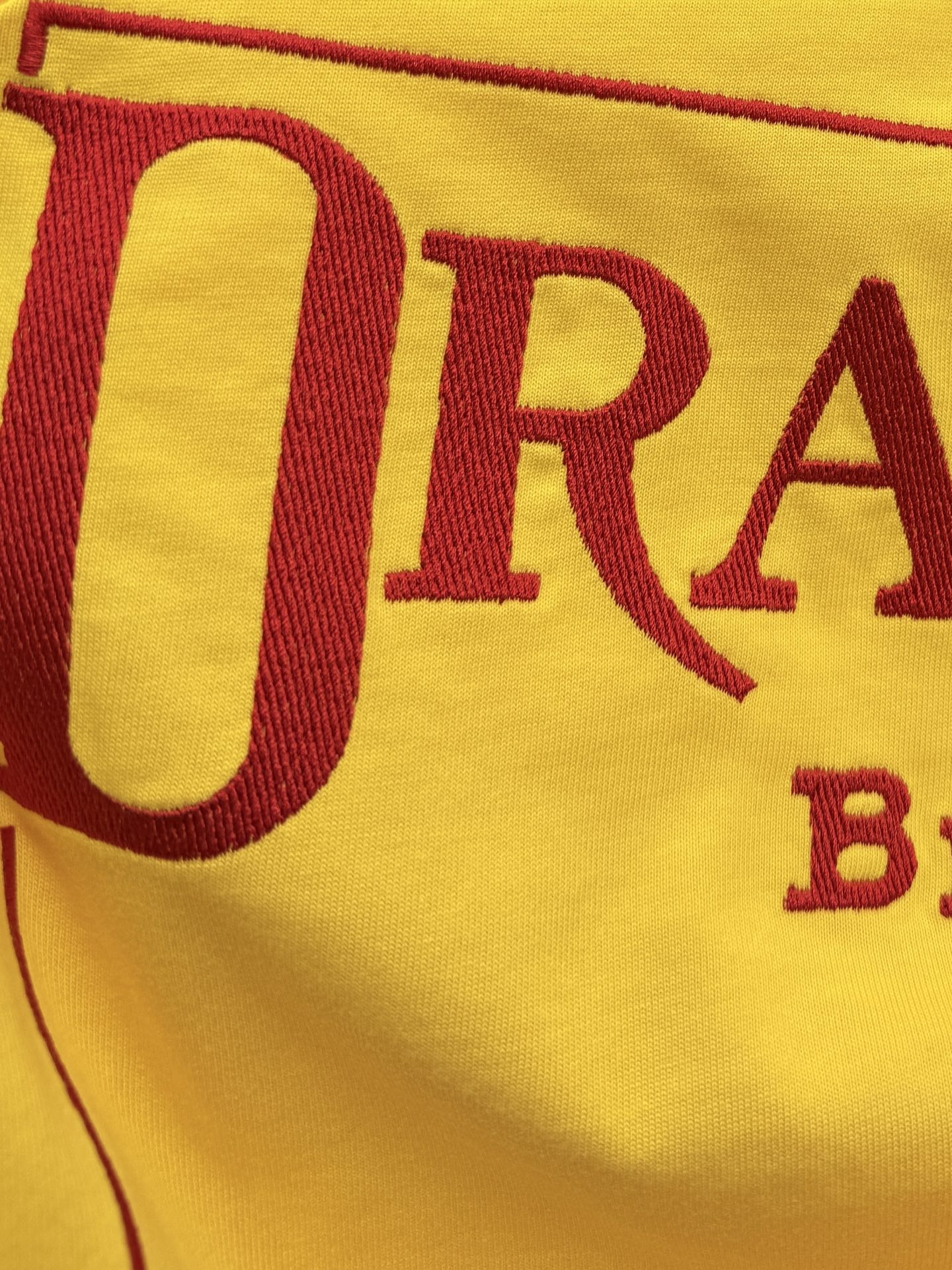 Yellow T-shirt front graphic with large red letters 'DRACULA'