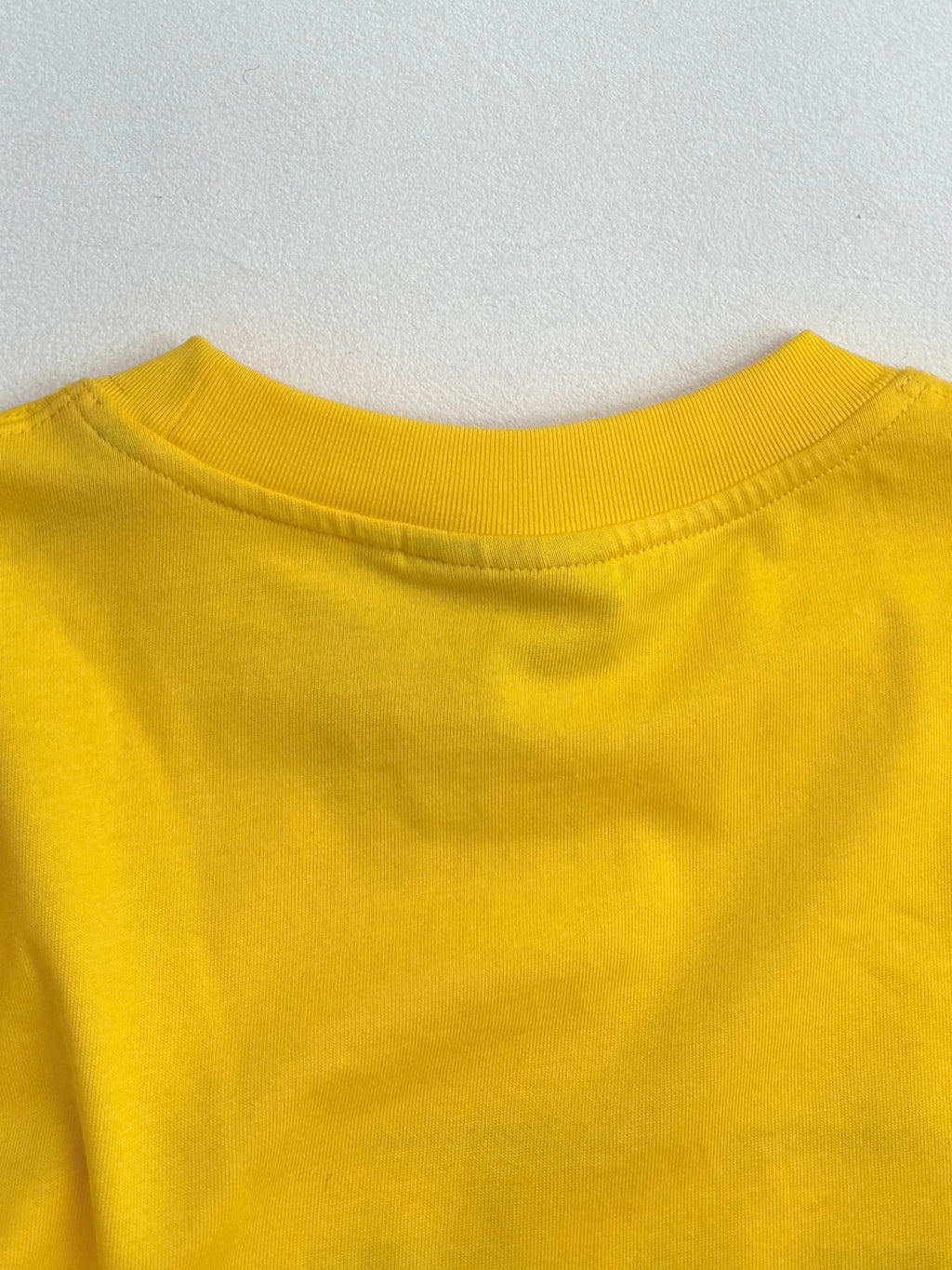 Yellow short-sleeve T-shirt with crew neck and smooth shoulder seam