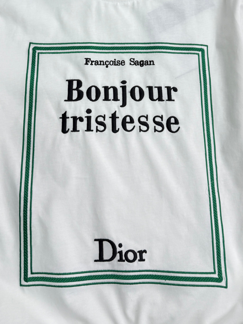 White Dior T-shirt front graphic: Bonjour tristesse with green border