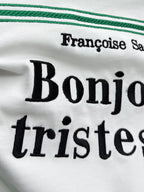 White Dior T-shirt close-up of large black Bonjour tristesse lettering