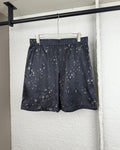 Black patterned shorts with elastic waistband and drawstring