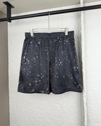 Black patterned shorts with elastic waistband and drawstring
