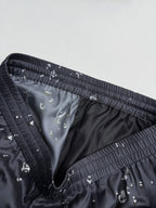 Black patterned shorts inner lining with elastic waistband and stitched seams
