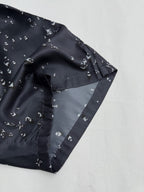 Black patterned shorts front with side seam and white motif print
