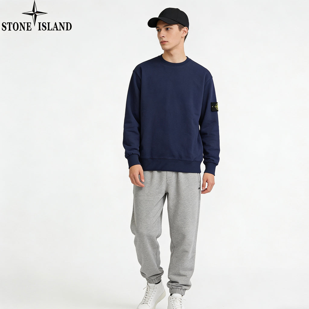 Navy Stone Island crewneck sweatshirt with sleeve patch, with light gray sweatpants