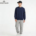 Navy Stone Island crewneck sweatshirt with sleeve patch, with light gray sweatpants
