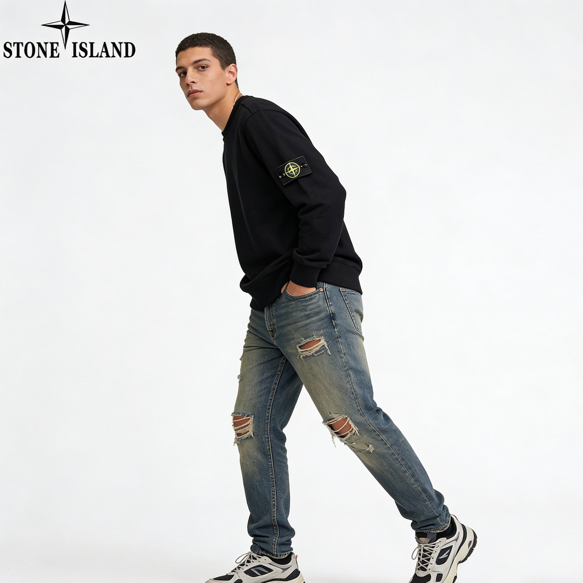 Stone Island black crewneck sweatshirt with sleeve patch, distressed blue jeans