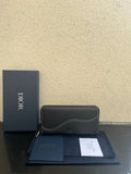 Dior small zip wallet bag in dark leather, curved front seam, gold zipper pull