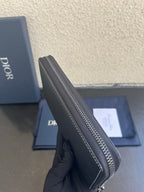Dior small zip wallet bag side profile with metal zipper track and stitched edge