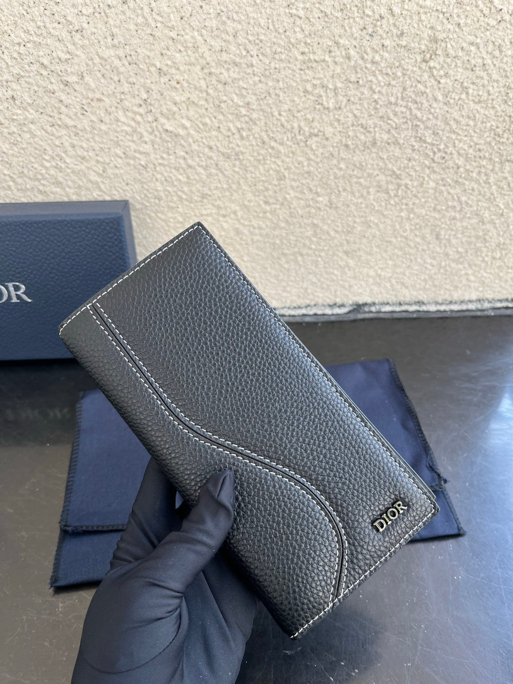 Small bag in dark gray pebbled leather with contrast-stitched edges and Dior logo