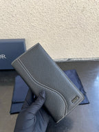 Small bag in dark gray pebbled leather with contrast-stitched edges and Dior logo
